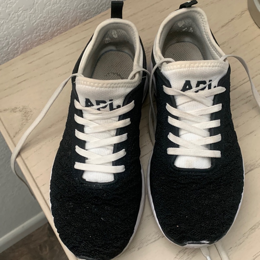 Womens APL athletic shoes, size 7, black and white